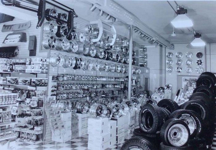 A black-and-white photo of a tire store