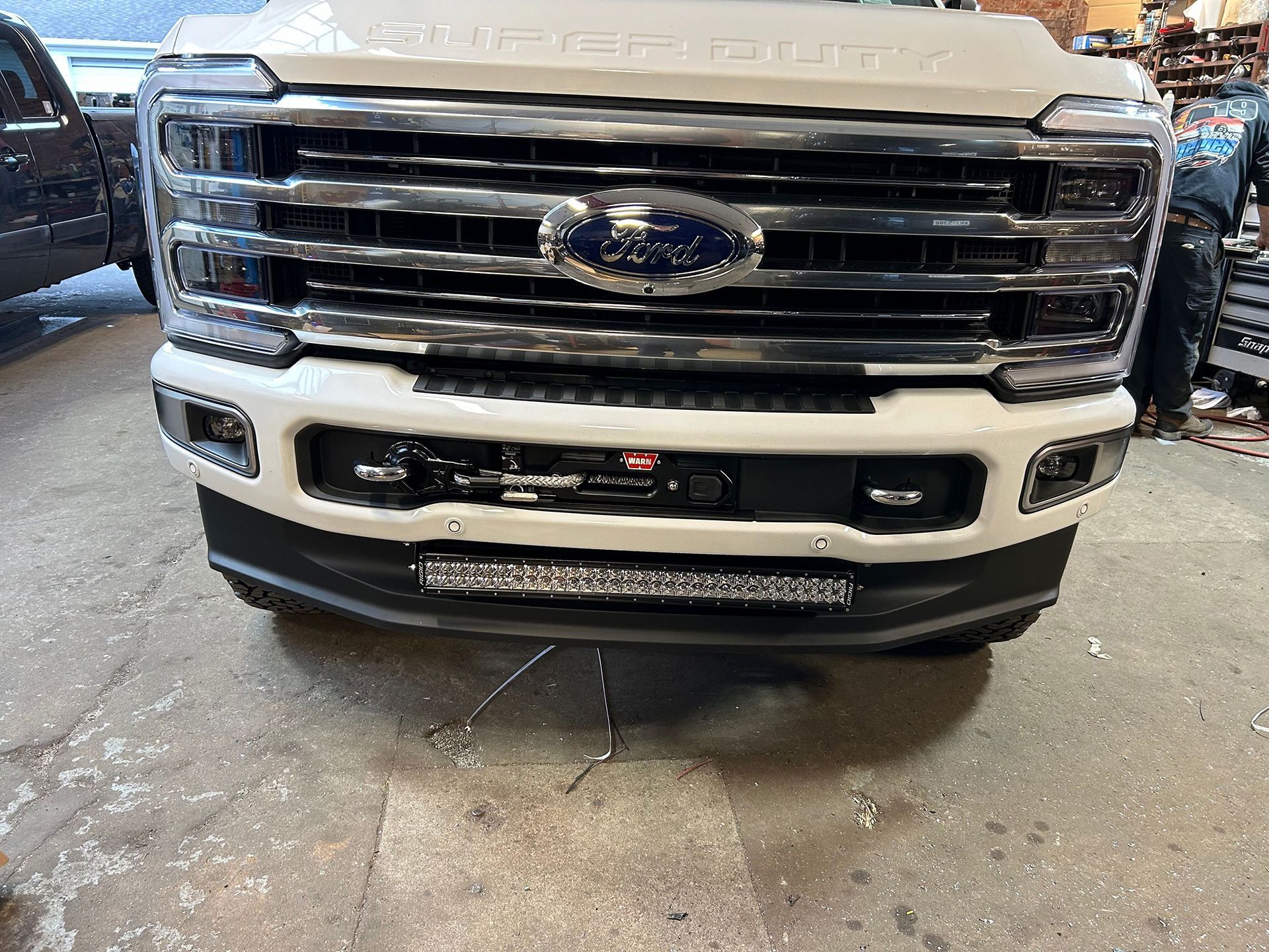 The front bumper side of a Ford truck
