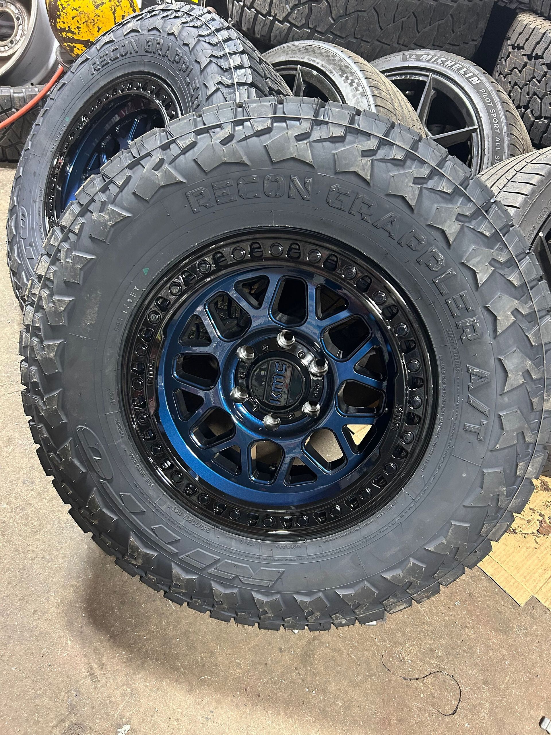 A stack of tires and wheels