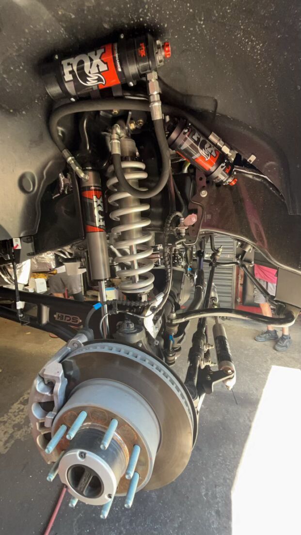 A close up of a suspension system on a truck