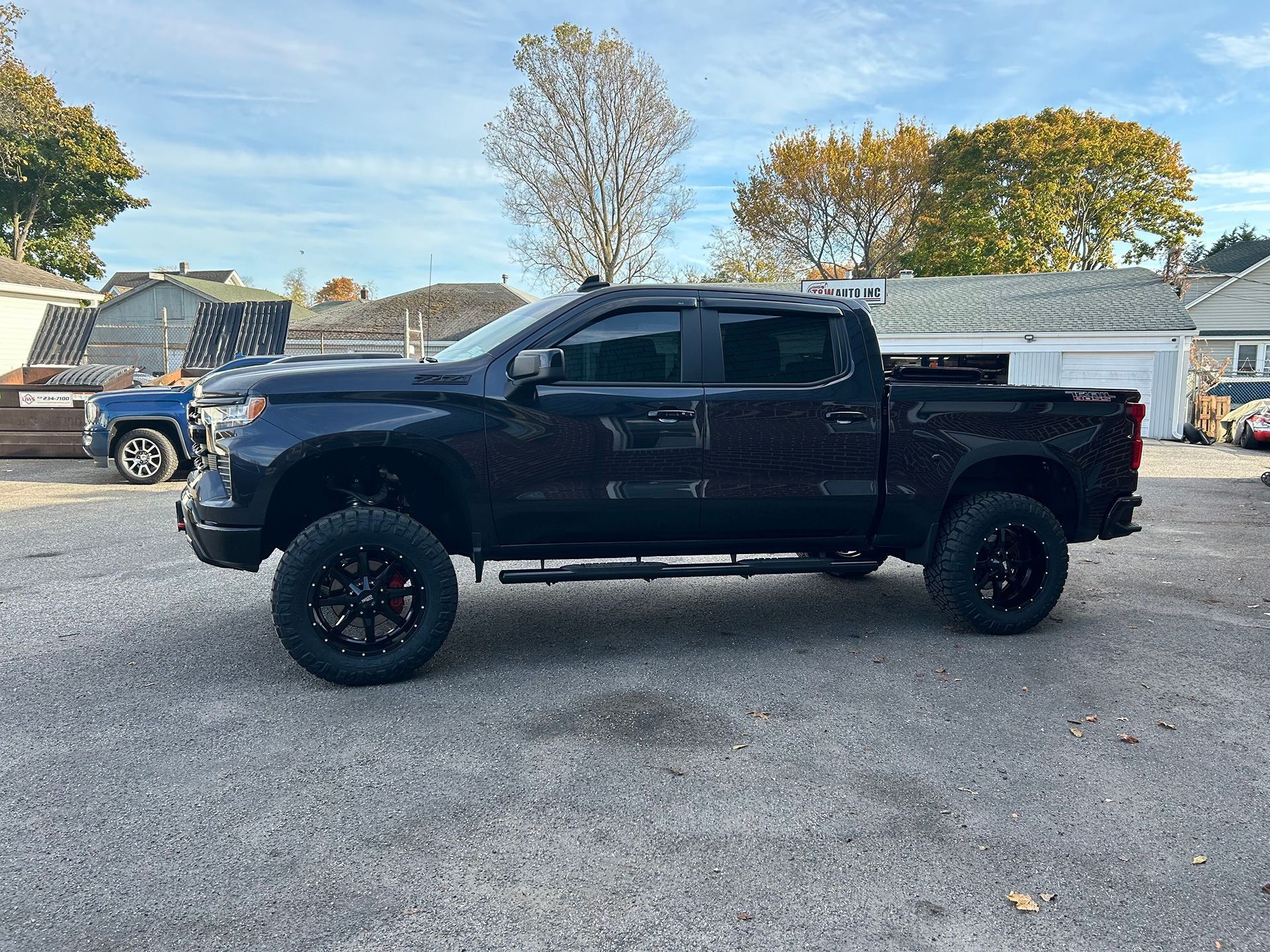 A black truck is parked outside