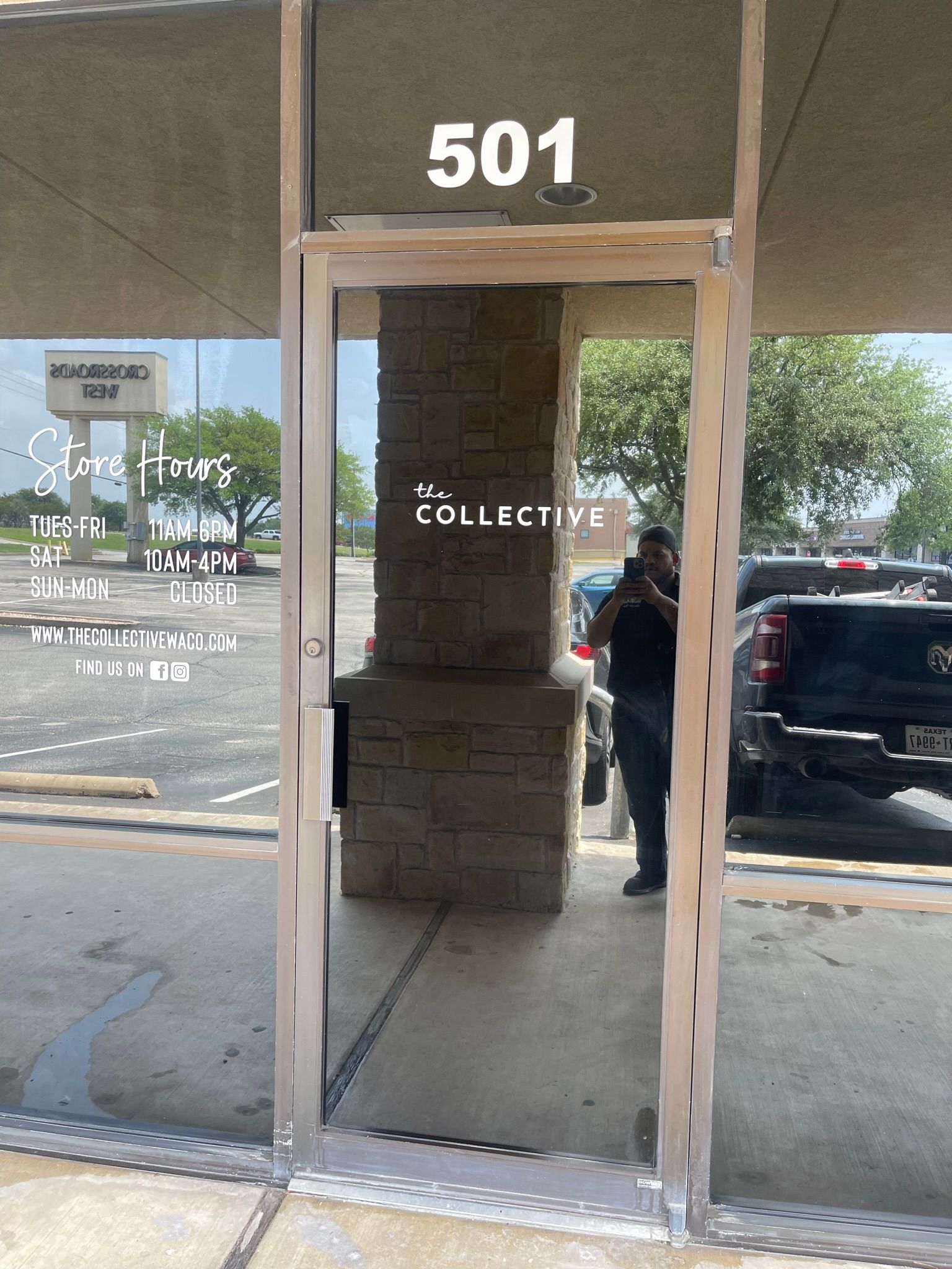 A man is standing in front of a door with the number 501 on it.