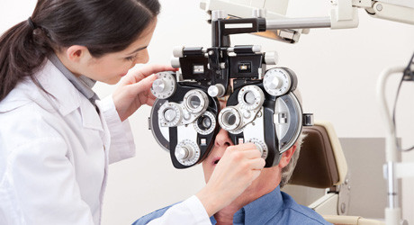 An eye doctor with her patient