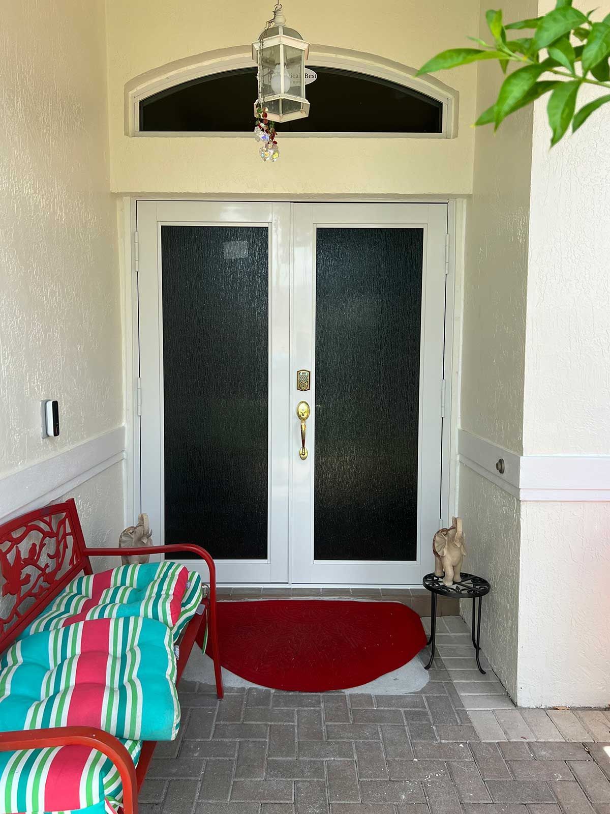 The front door of a house has a lantern above it