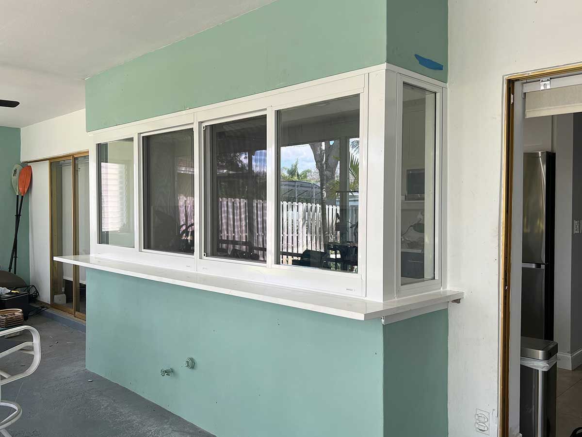 A room with a lot of windows on the wall.