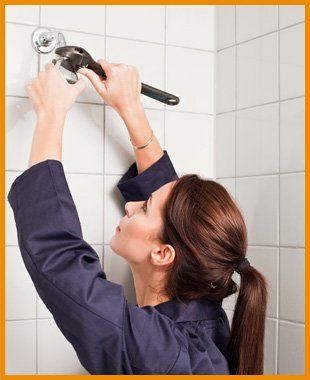 Woman repairing in shower room