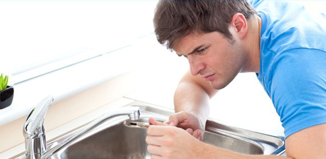 Man repairing sink