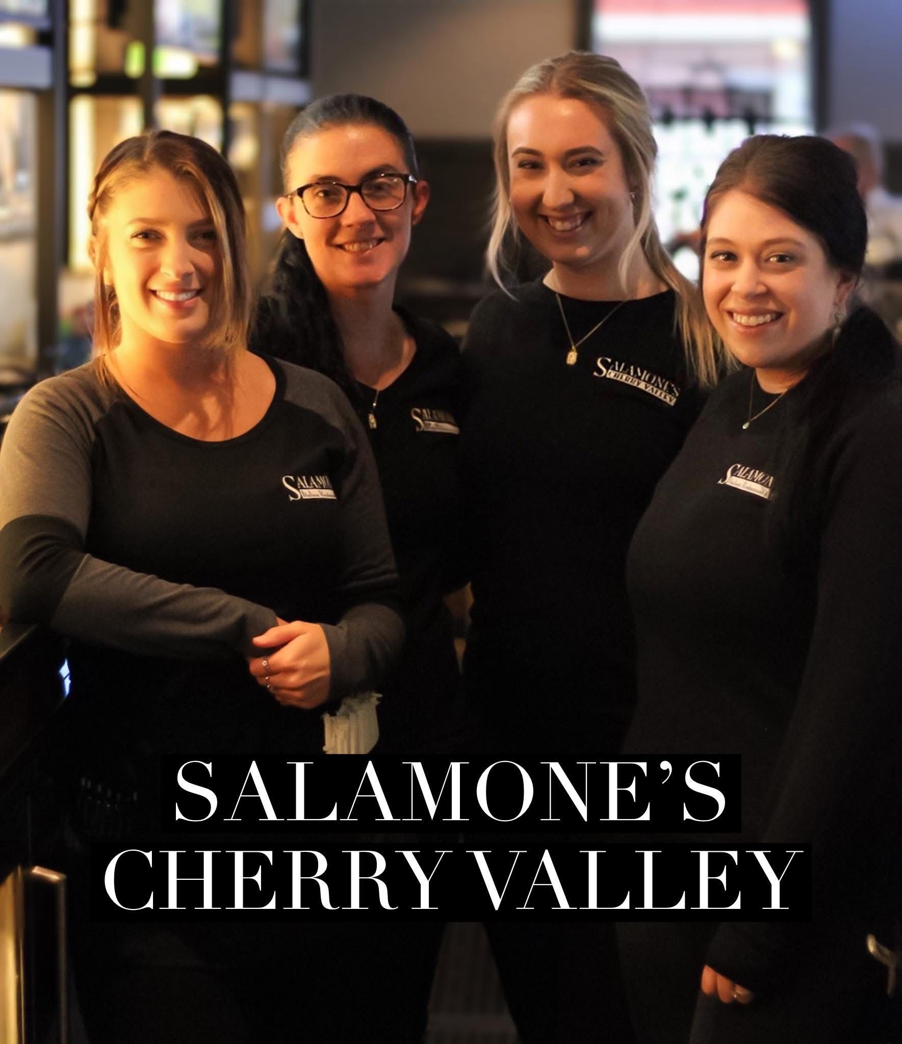 A group of women are posing for a picture