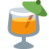 Orange cocktail in a tilted glass with a green garnish and a straw on a light background