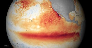 Jupiter with a large red storm band across its equator and swirling orange-white clouds