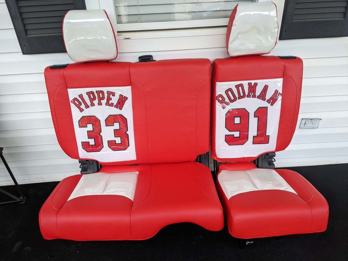 Red and white custom car seats with Pippen 33 and Rodman 91 jerseys.