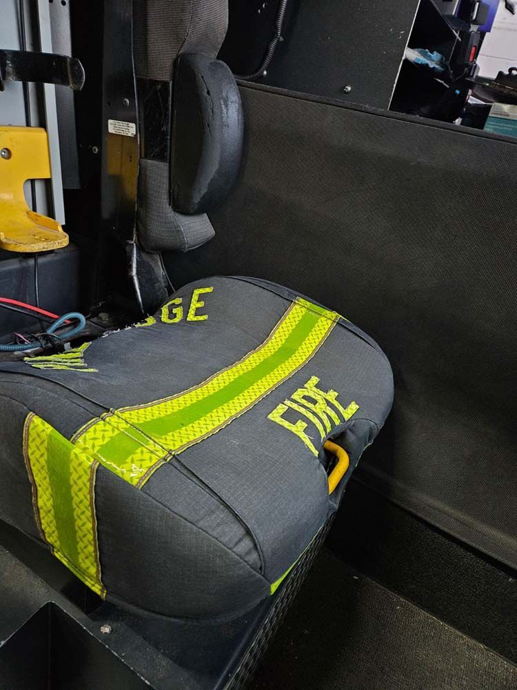 Firefighter seat with black and neon green accents; 