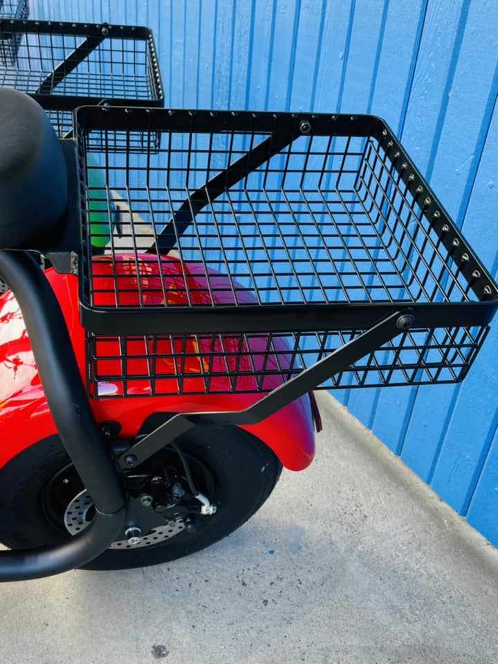 A red scooter with a basket attached to the back