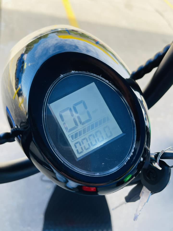 A close up of a digital display on a scooter that says 00