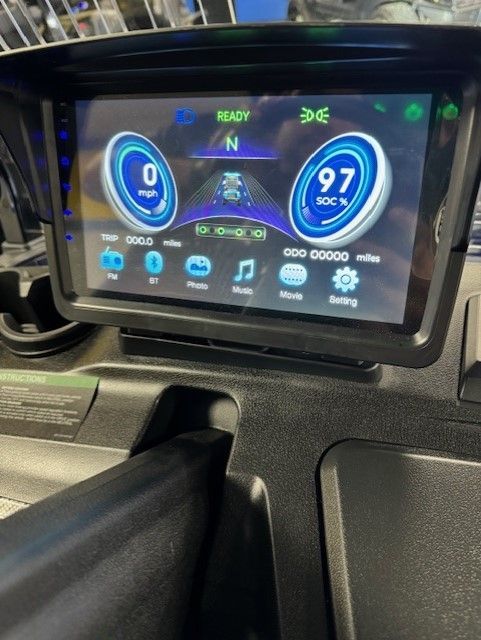 A digital dashboard displays speed and other vehicle information. It shows a speedometer, 97 mph, a driving lane graphic, and various function icons.