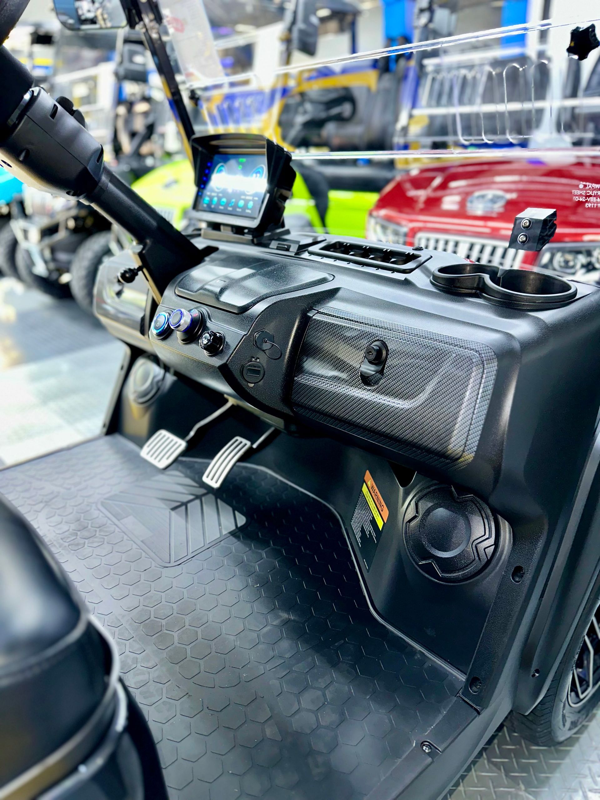 A close up of the dashboard of a golf cart.