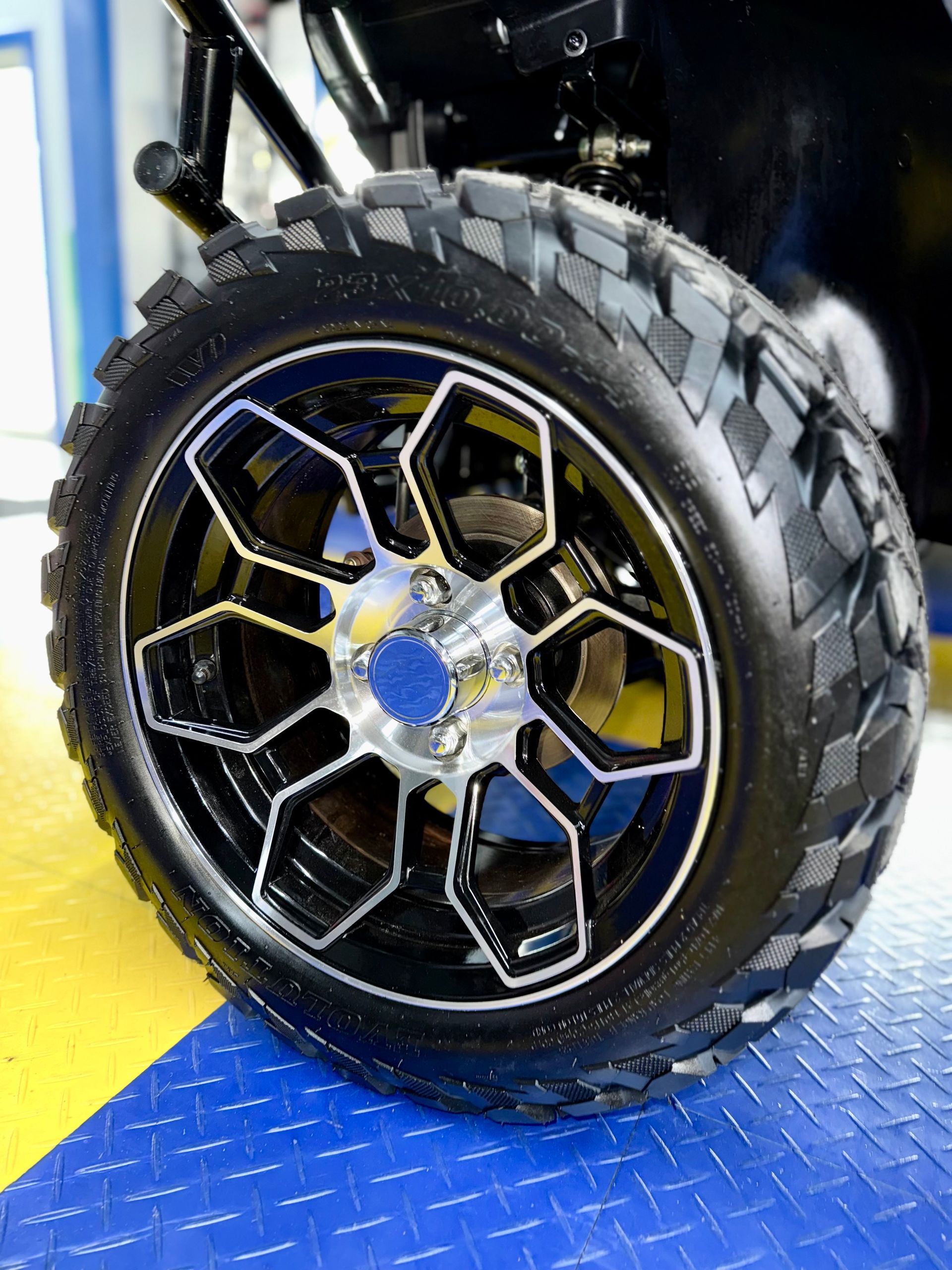 A close up of a wheel and tire on a vehicle.