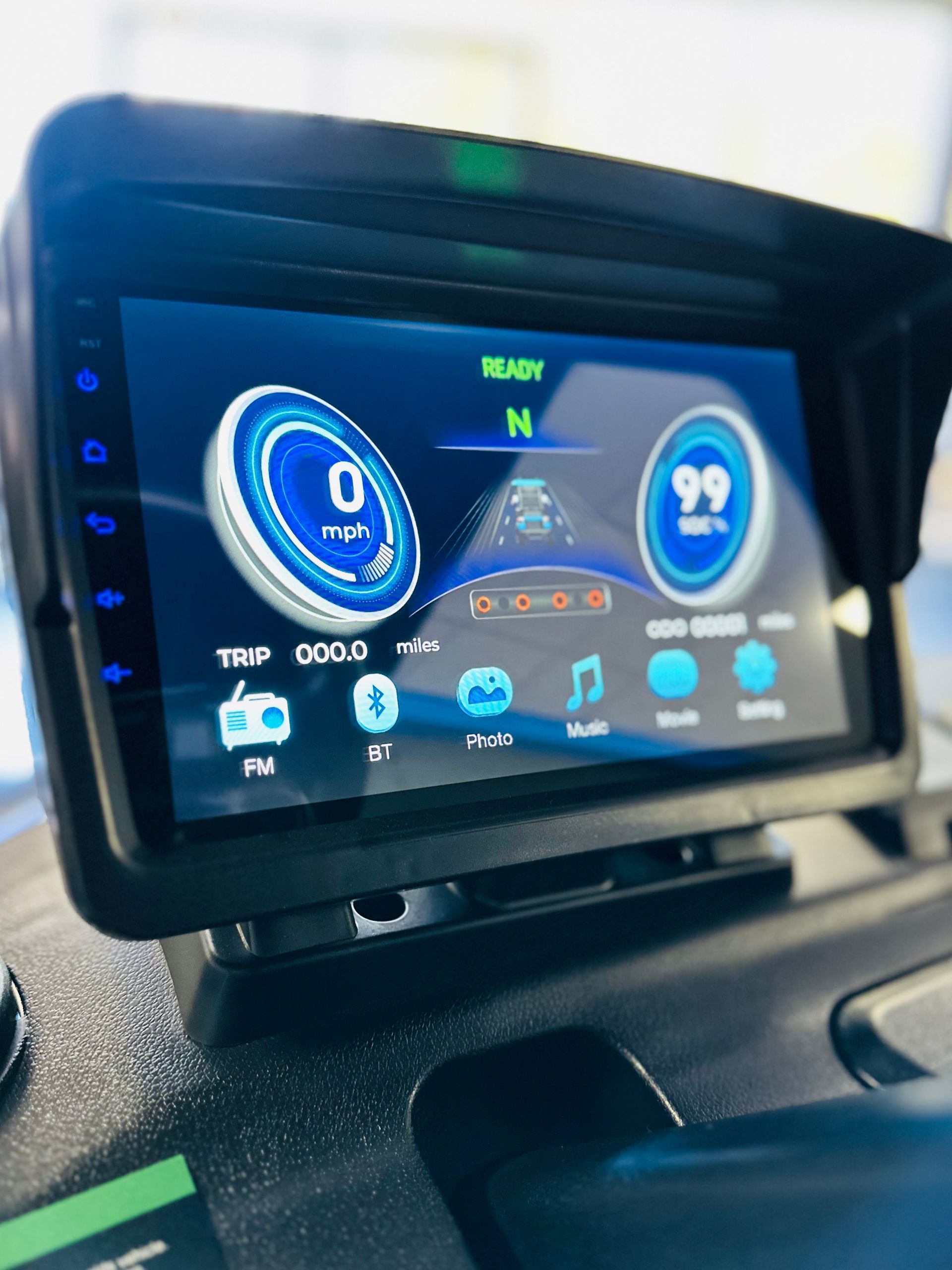 A car dashboard with a screen that says 99 on it