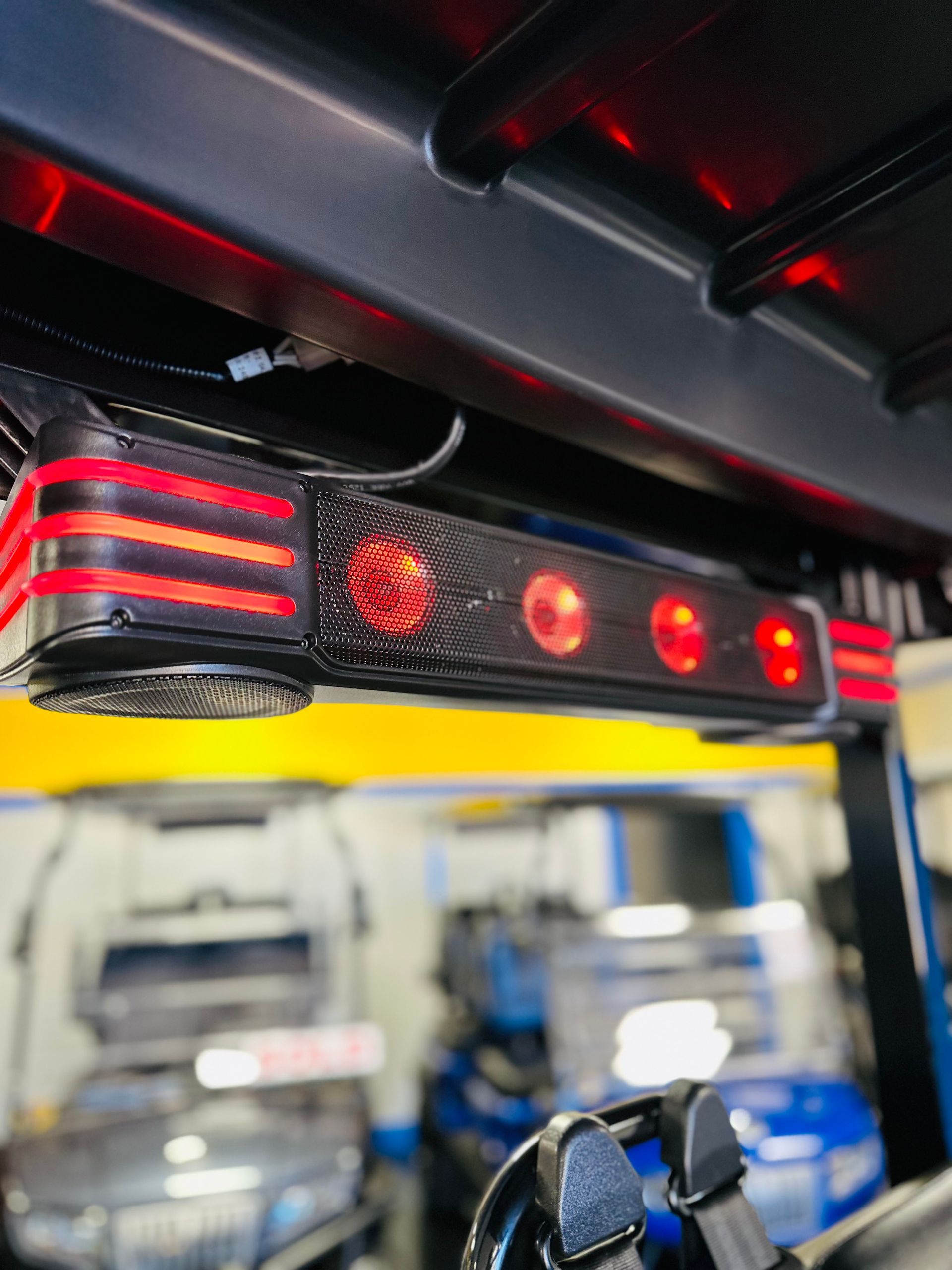 A close up of a speaker on top of a golf cart.
