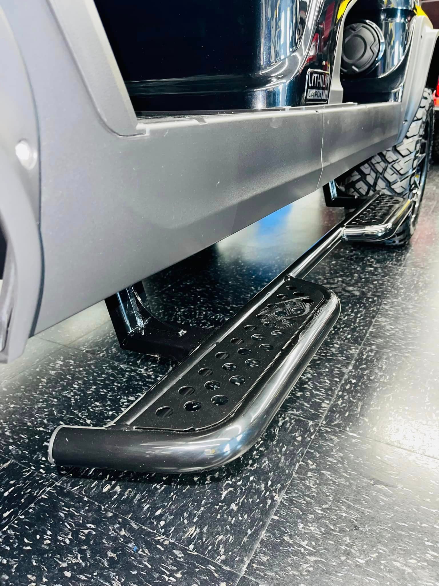 A close up of a side step on a truck.