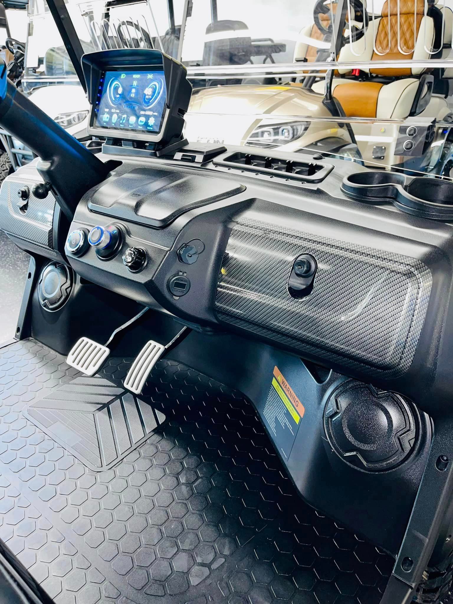 A close up of the dashboard of a golf cart.
