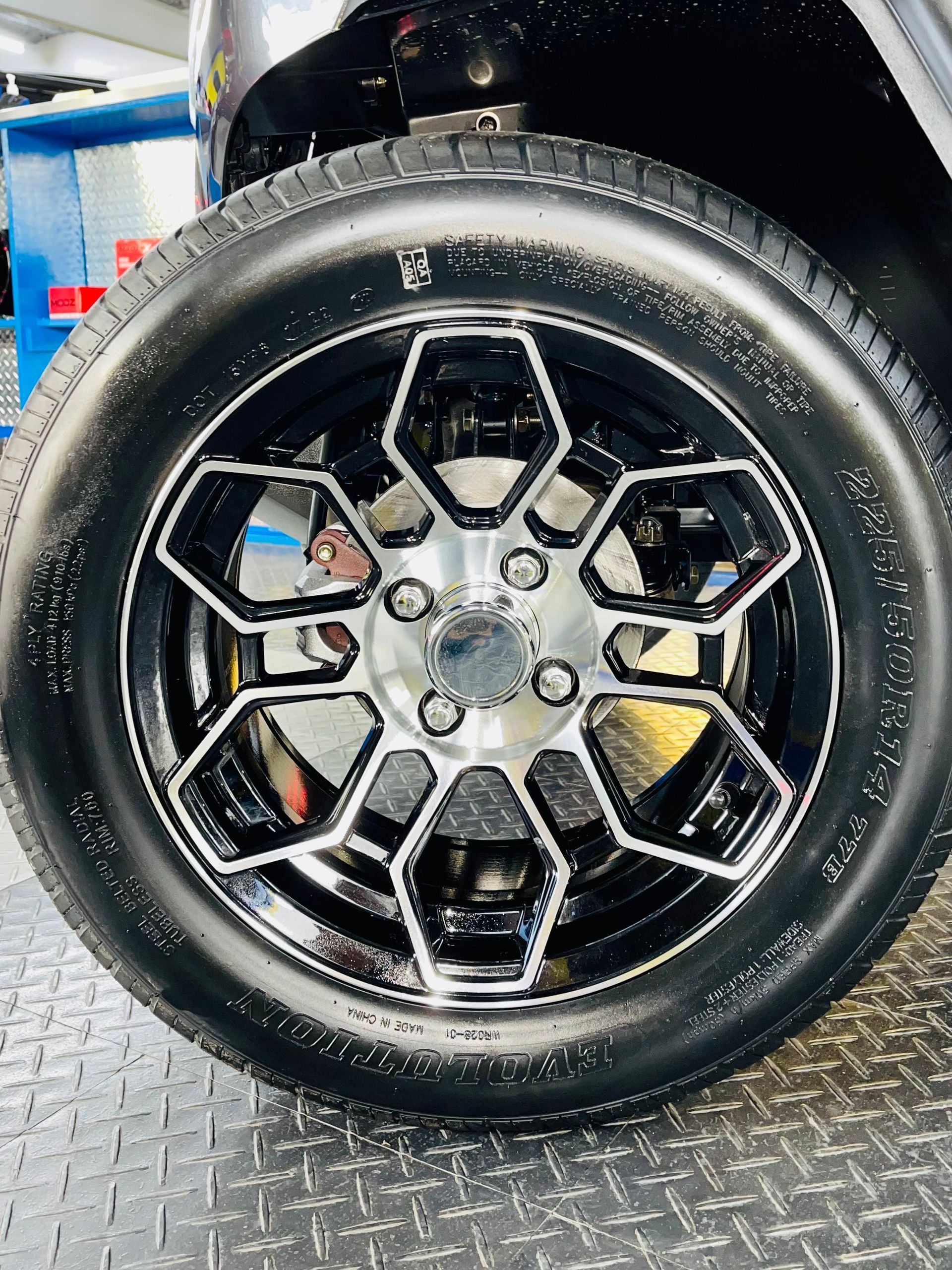 A close up of a car wheel with a tire on it