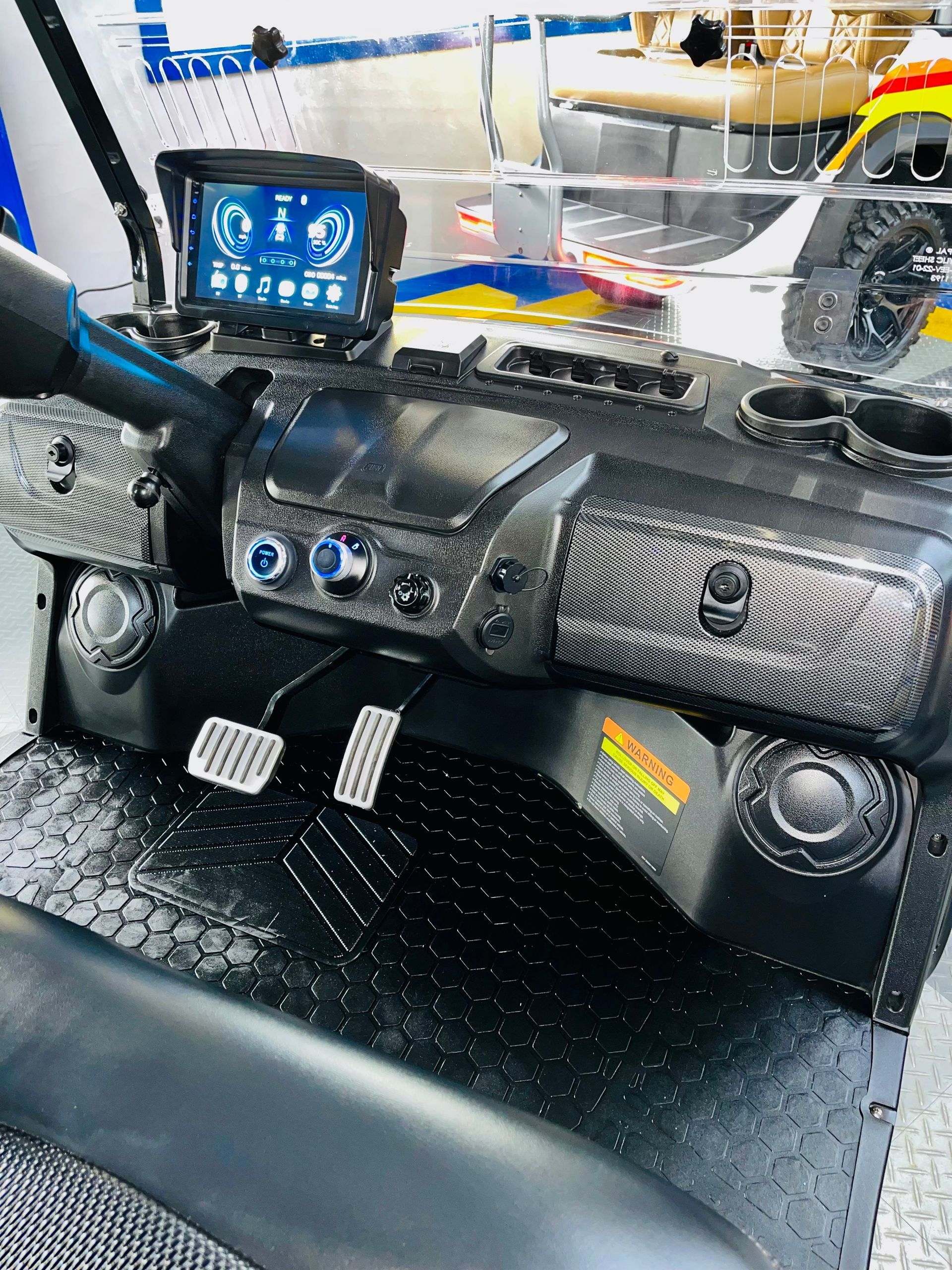 A close up of the dashboard of a golf cart.