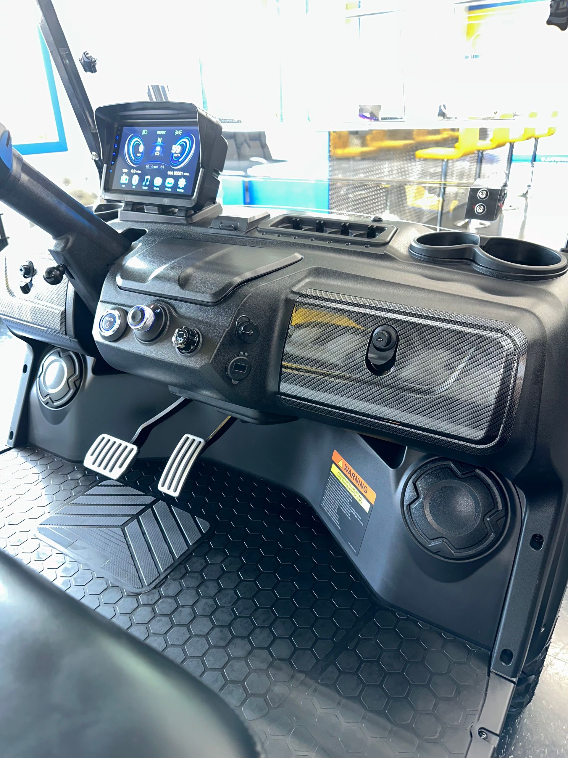 A close up of the dashboard of a golf cart.