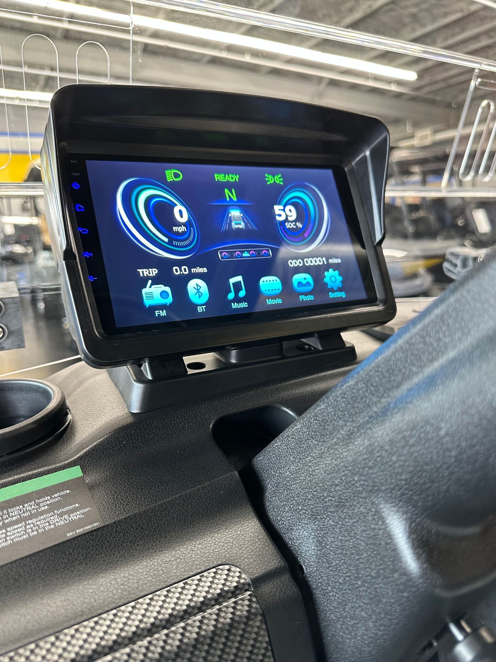 A close up of a dashboard with a monitor on it.