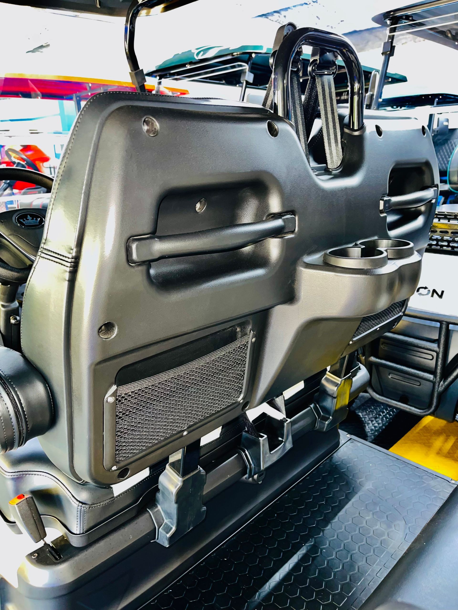 A close up of a car seat with a handle on it