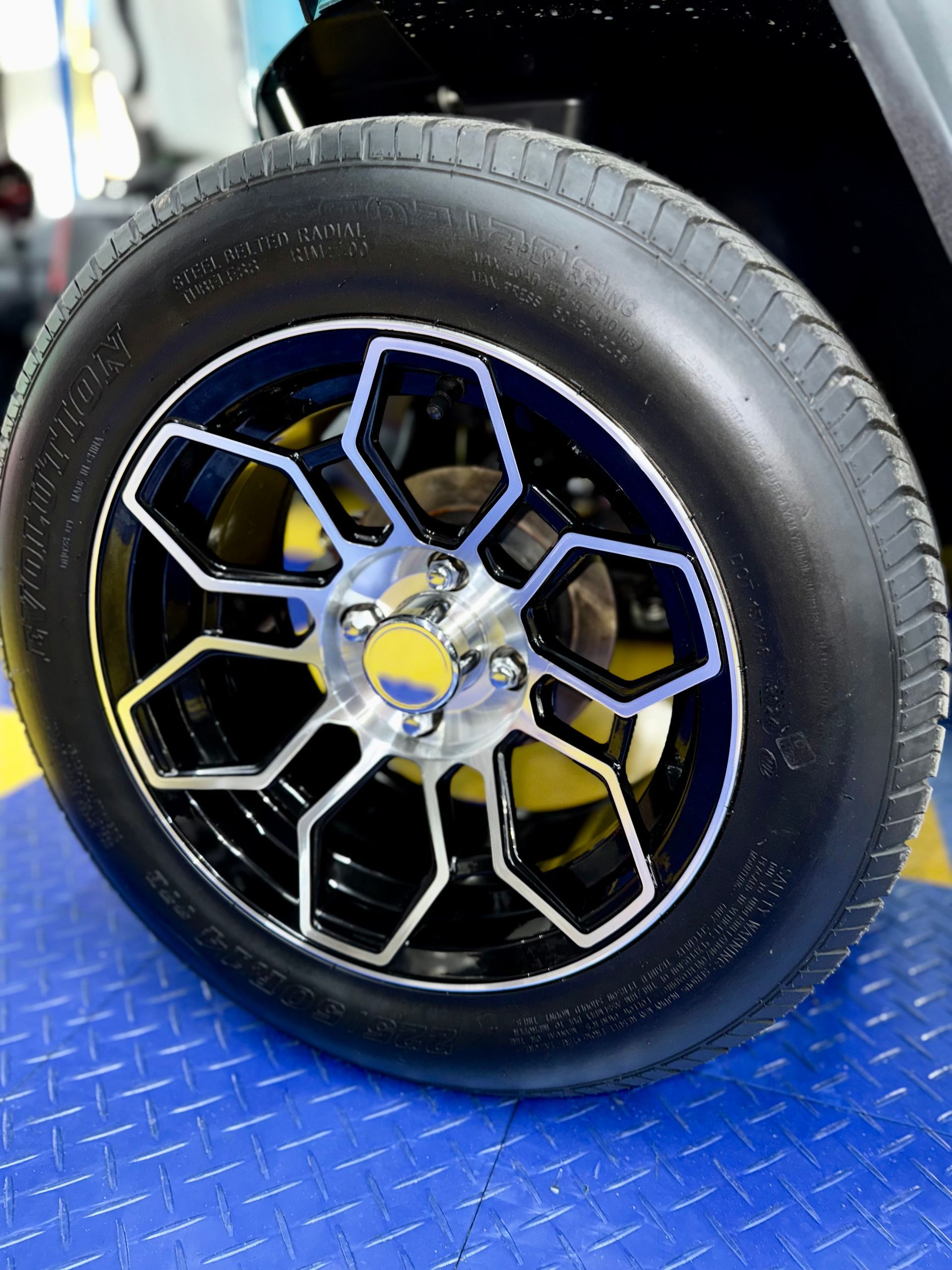 A close up of a car wheel with a tire on it