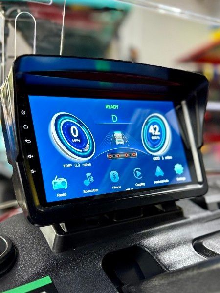 A car radio with the number 42 on the screen