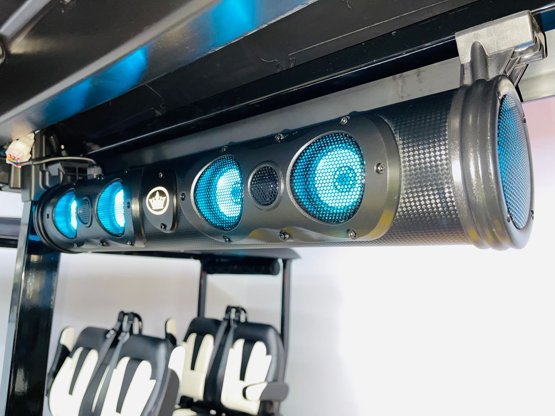 A bunch of blue lights are hanging from a ceiling