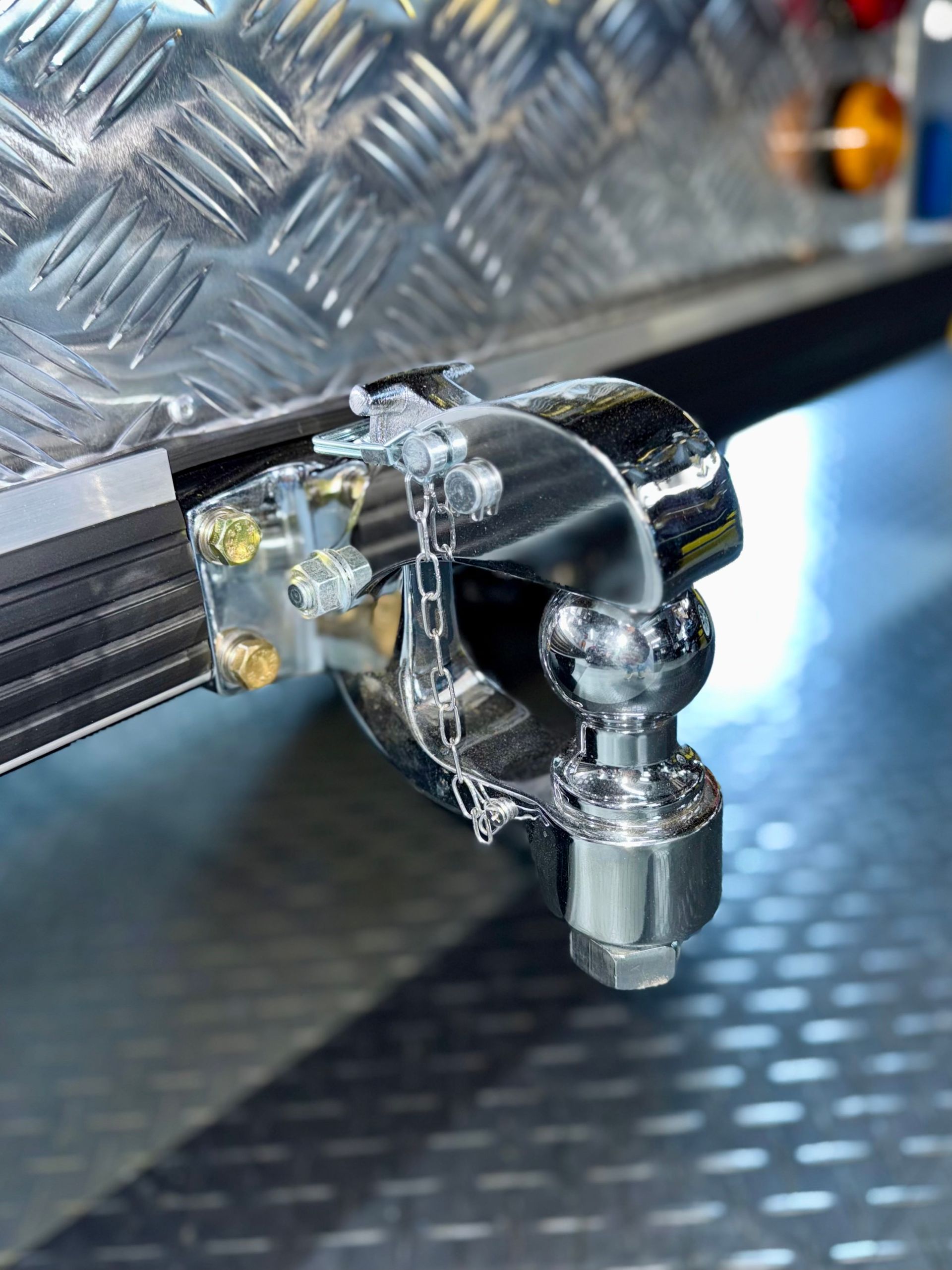 A close up of a tow ball attached to a trailer.