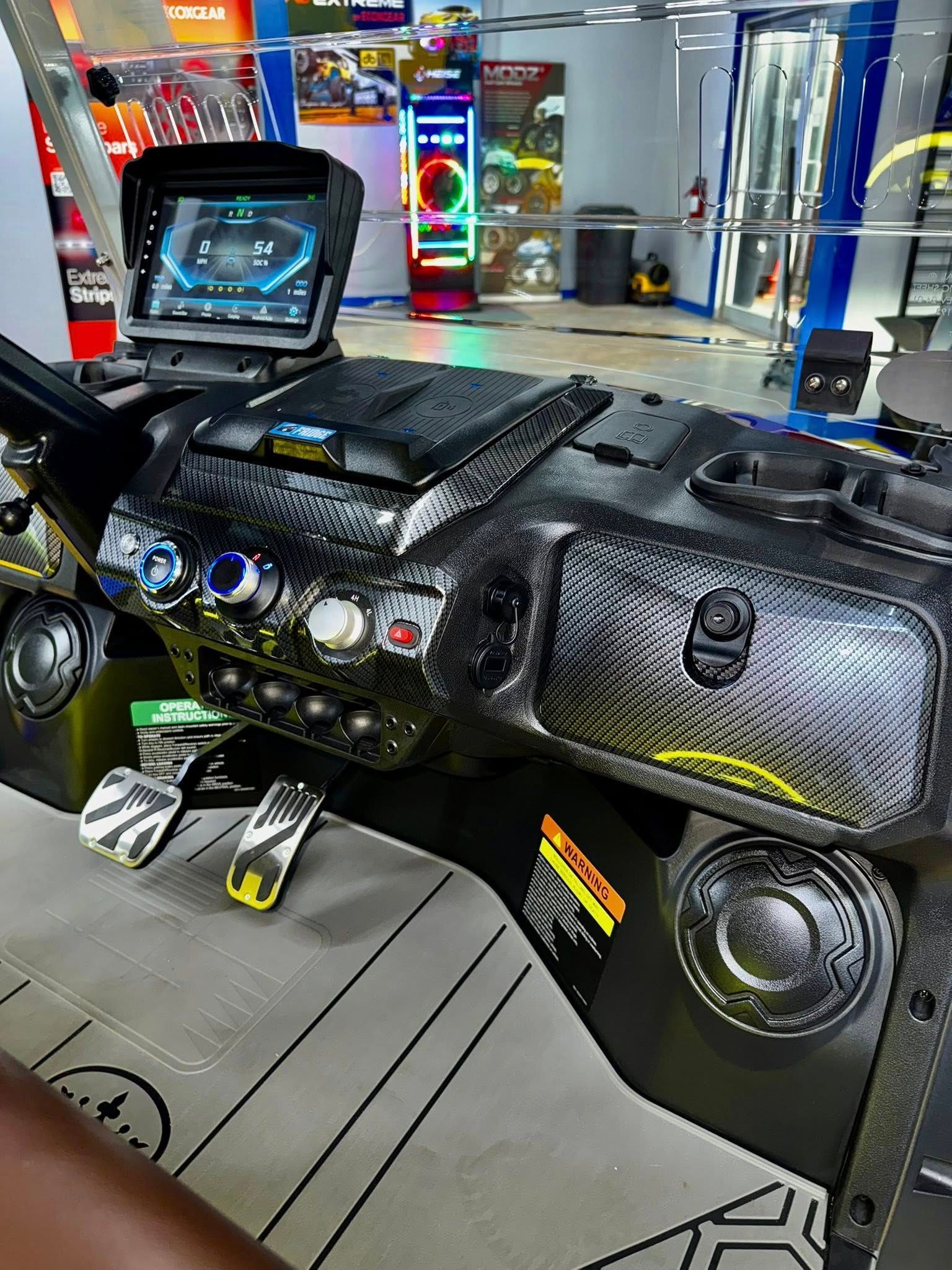 A close up of a dashboard of a vehicle in an arcade.