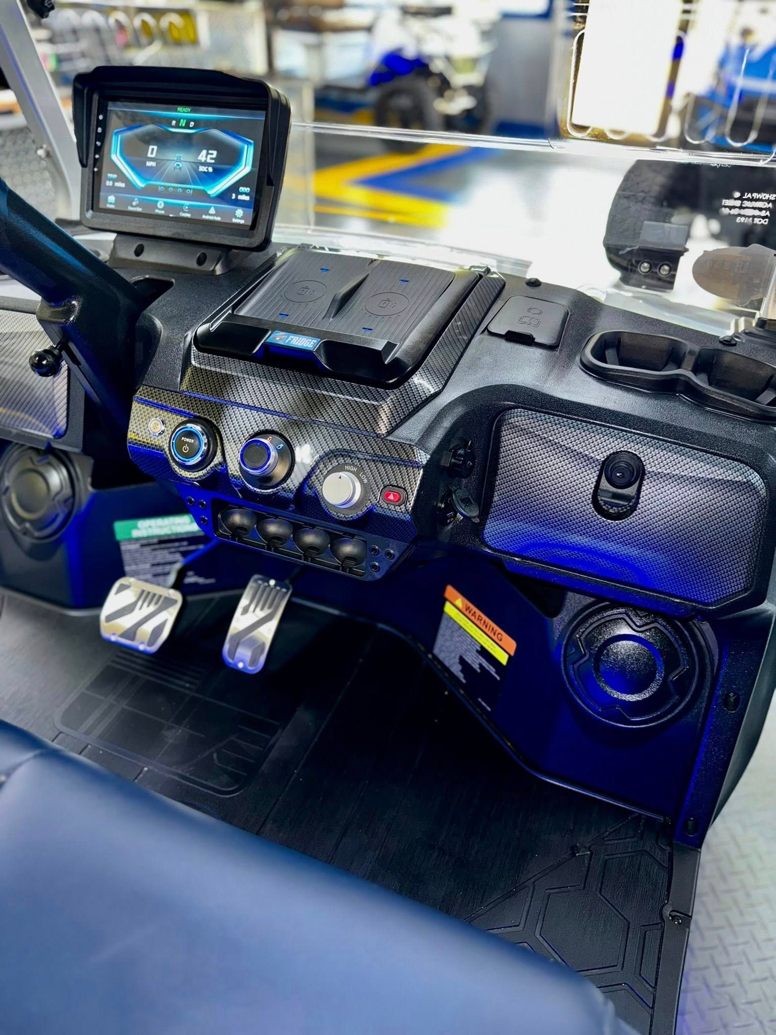 A close up of the dashboard of a golf cart.