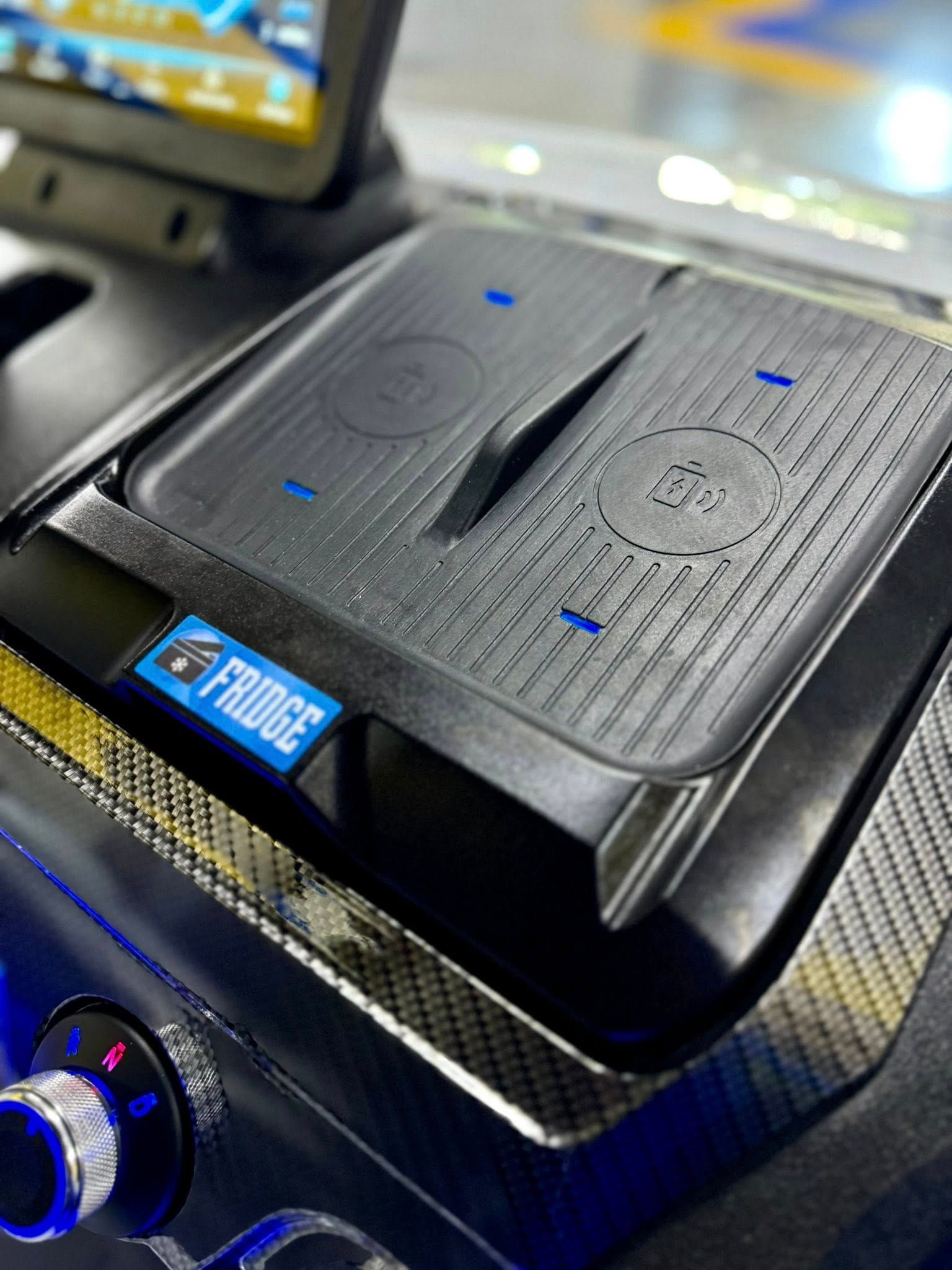 A close up of a wireless charger in a car.