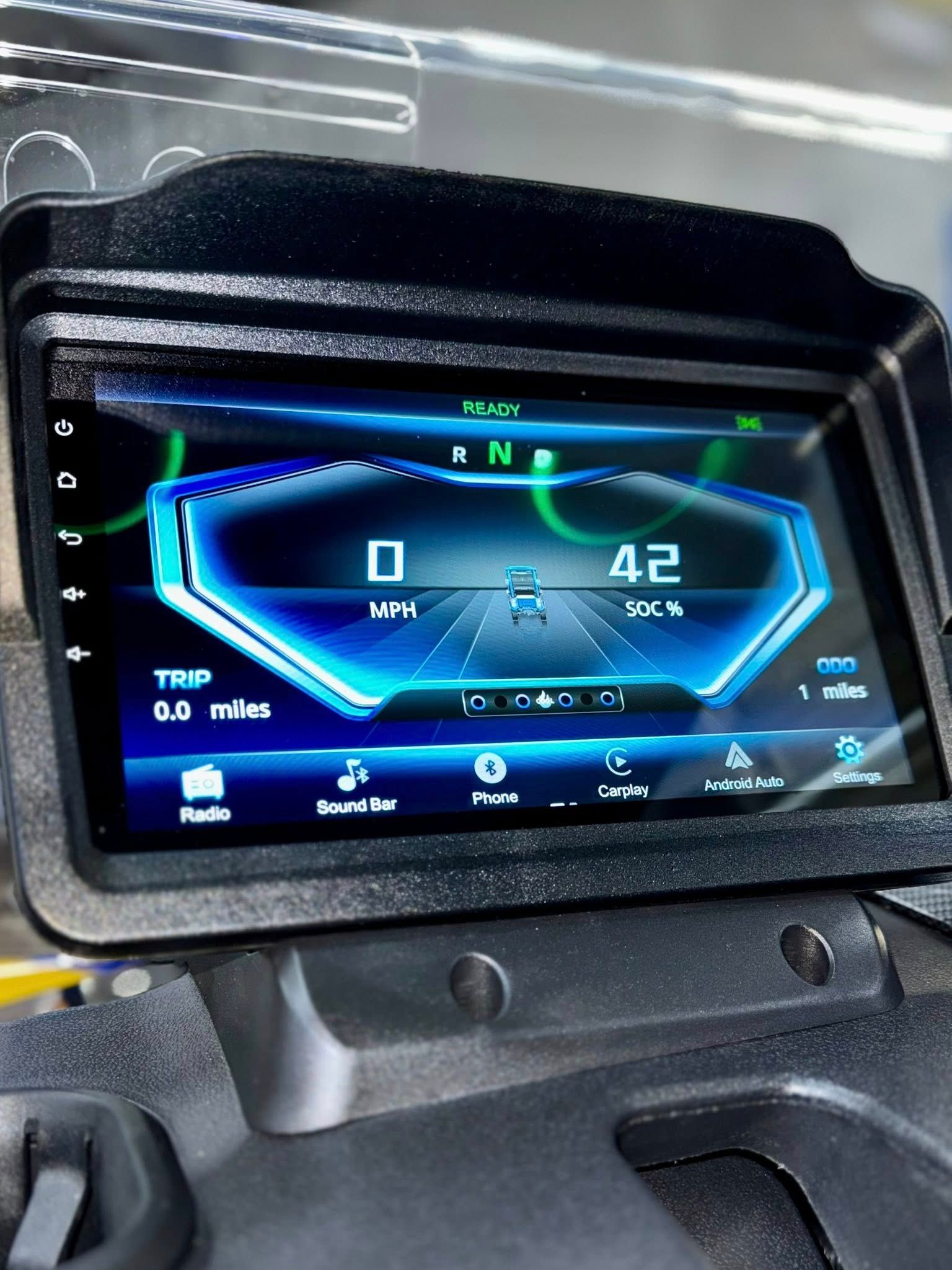 A close up of a car dashboard with a gps on it.
