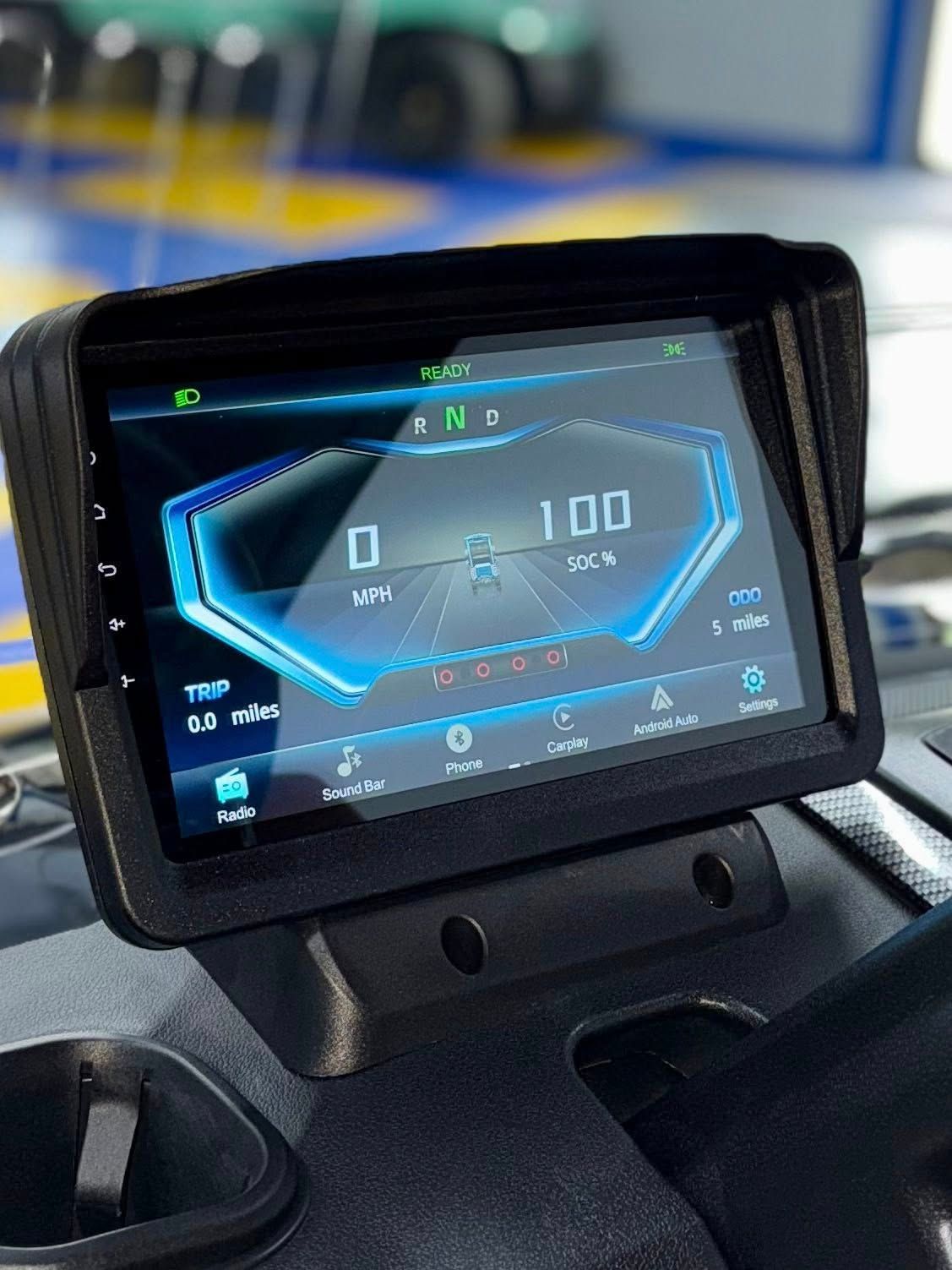 Digital vehicle dashboard displaying speedometer, trip, and other information.