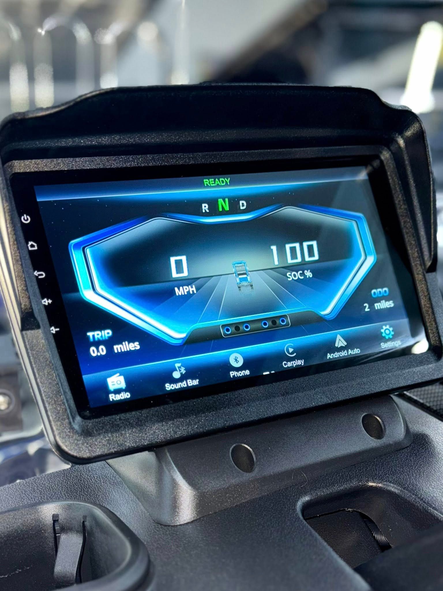 Digital car dashboard displaying speed, gear, and other information.