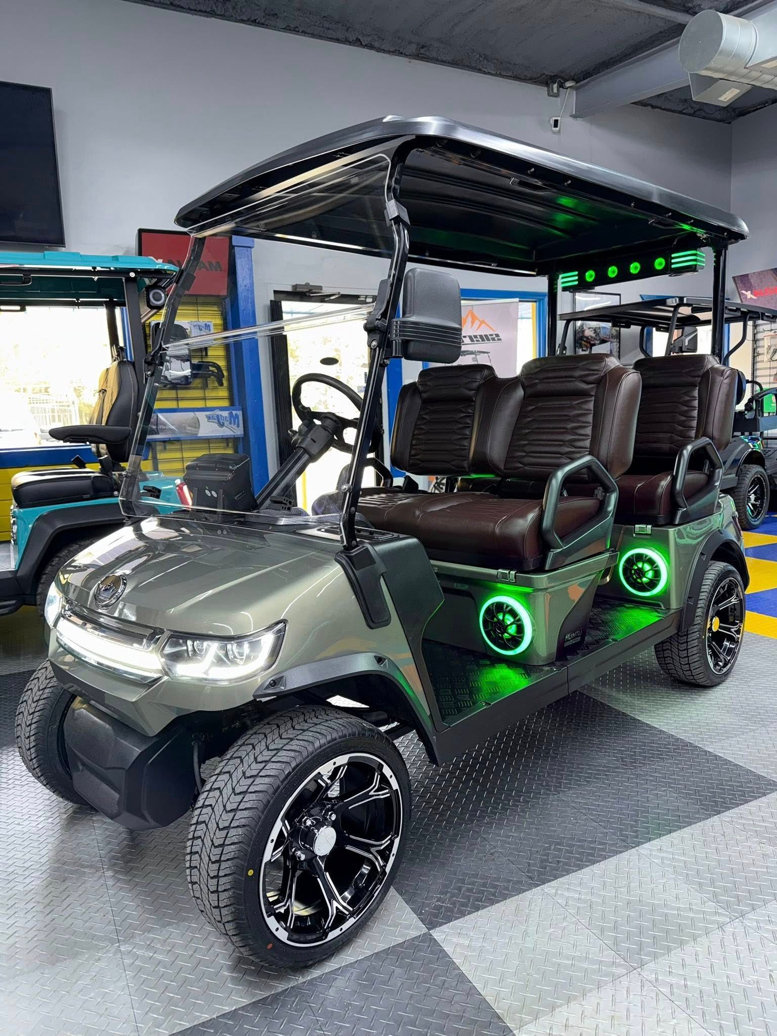 Olive green six-seater golf cart with black accents and green underglow.