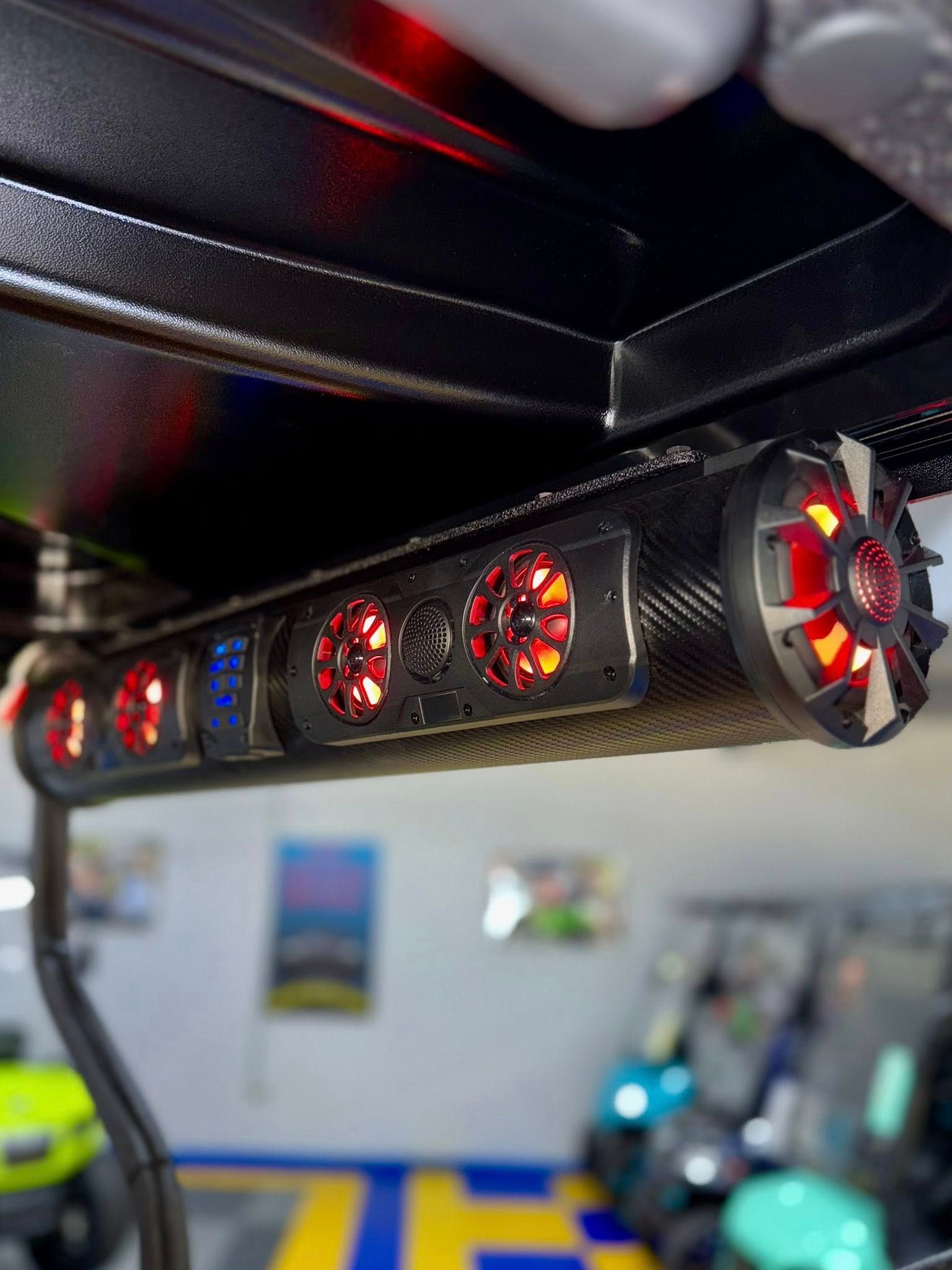 Black golf cart audio system with red and blue LED lights.