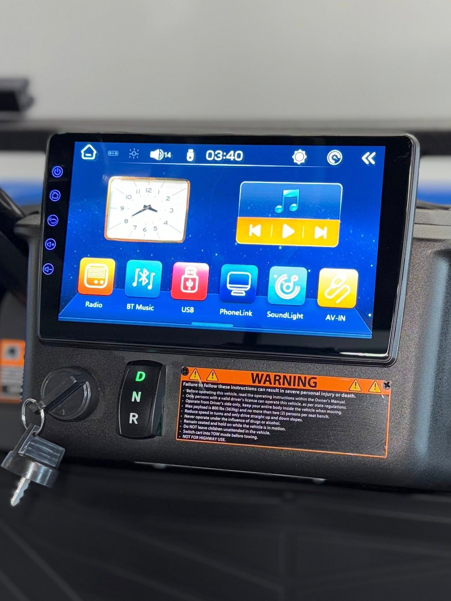 Golf cart dashboard with digital screen displaying apps, clock, and audio controls.