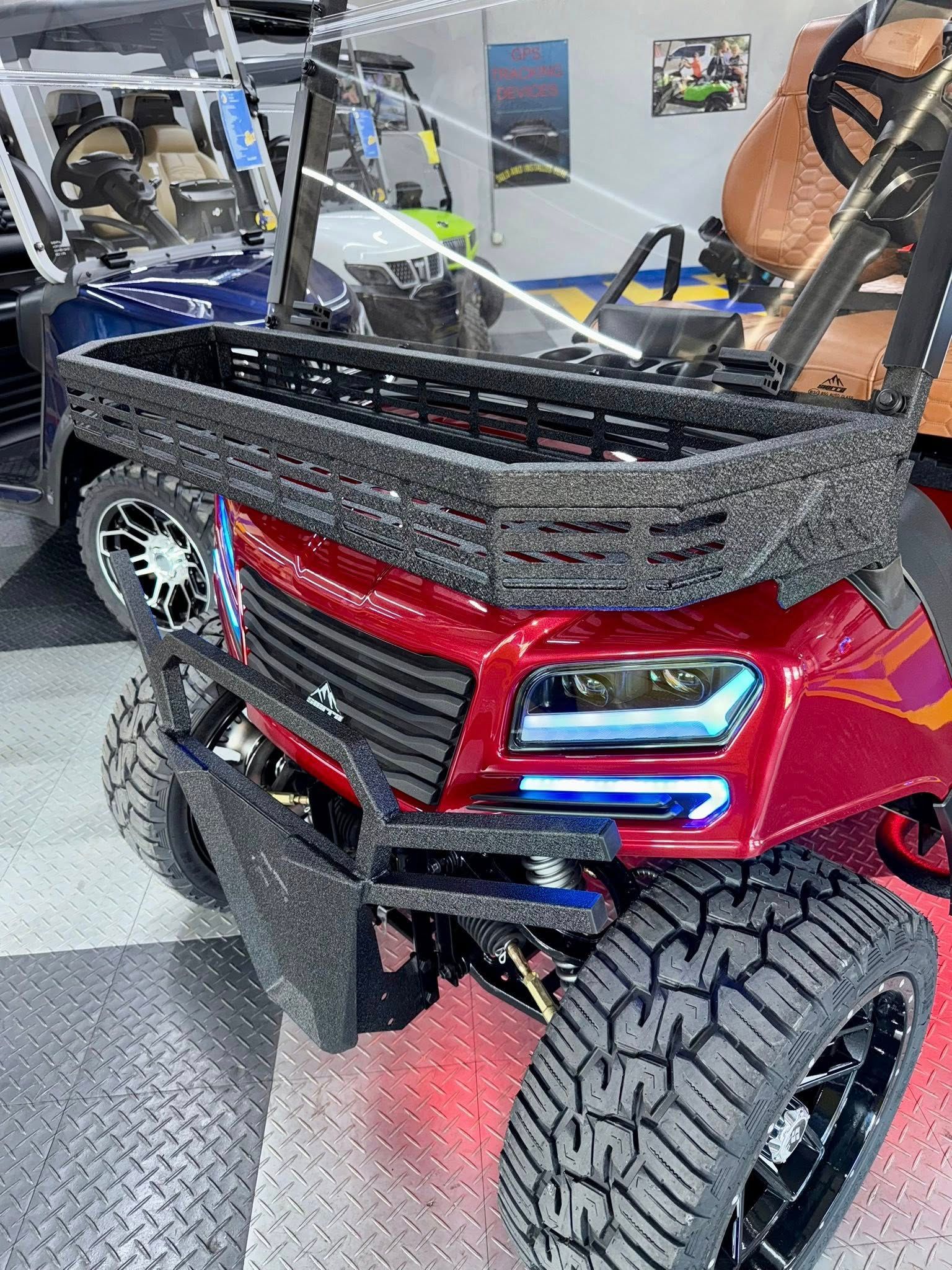 Red custom golf cart with a basket on the front, black tires, and a modern look.