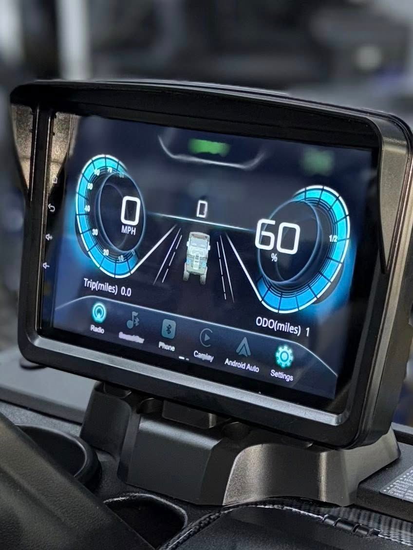 Dashboard display showing speedometer at 0 and 60, road ahead, and vehicle icons.