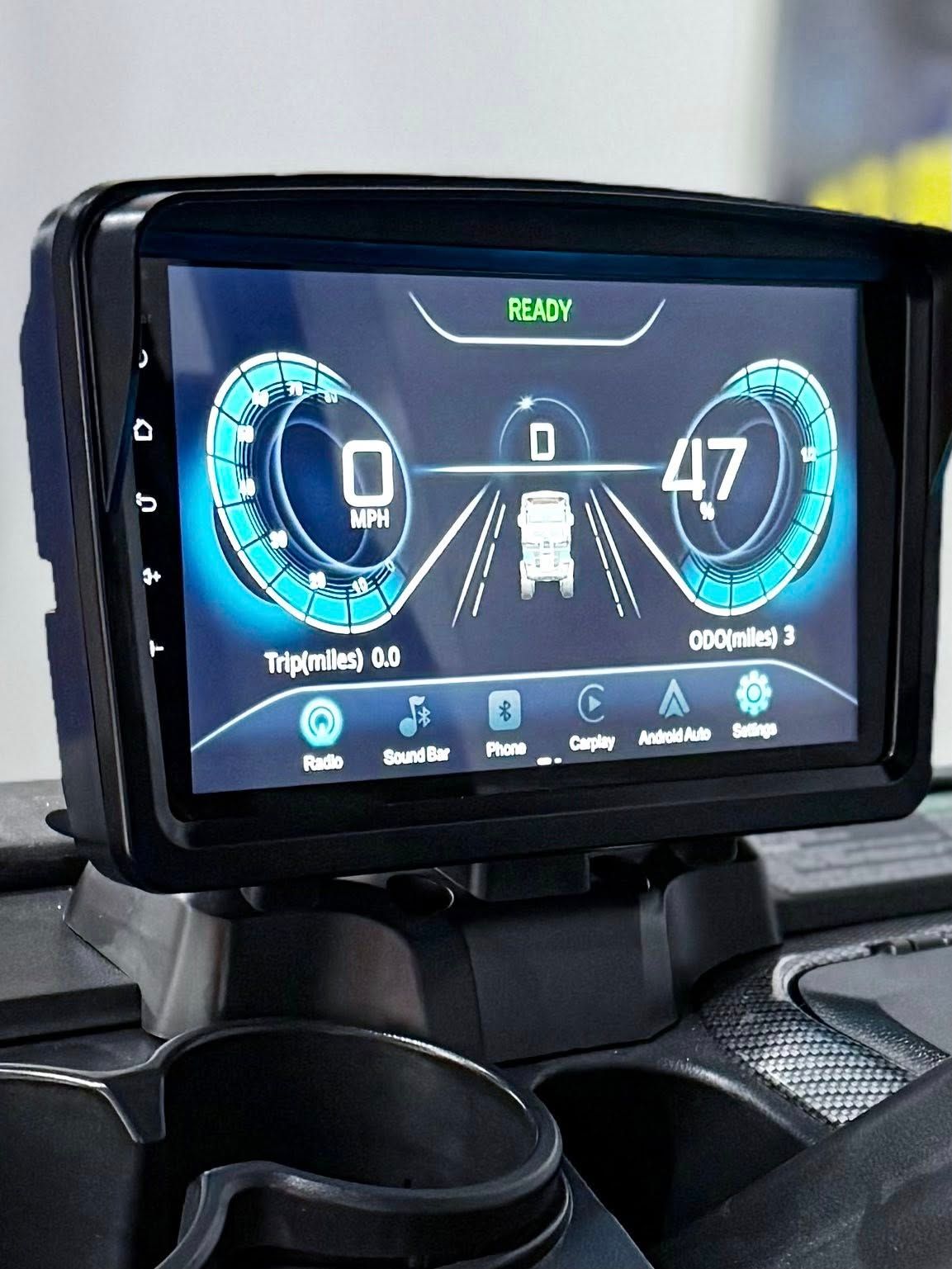 Digital dashboard display in a vehicle. Shows speedometer, gear indicator, and driving lane graphics, with a speed of 47.