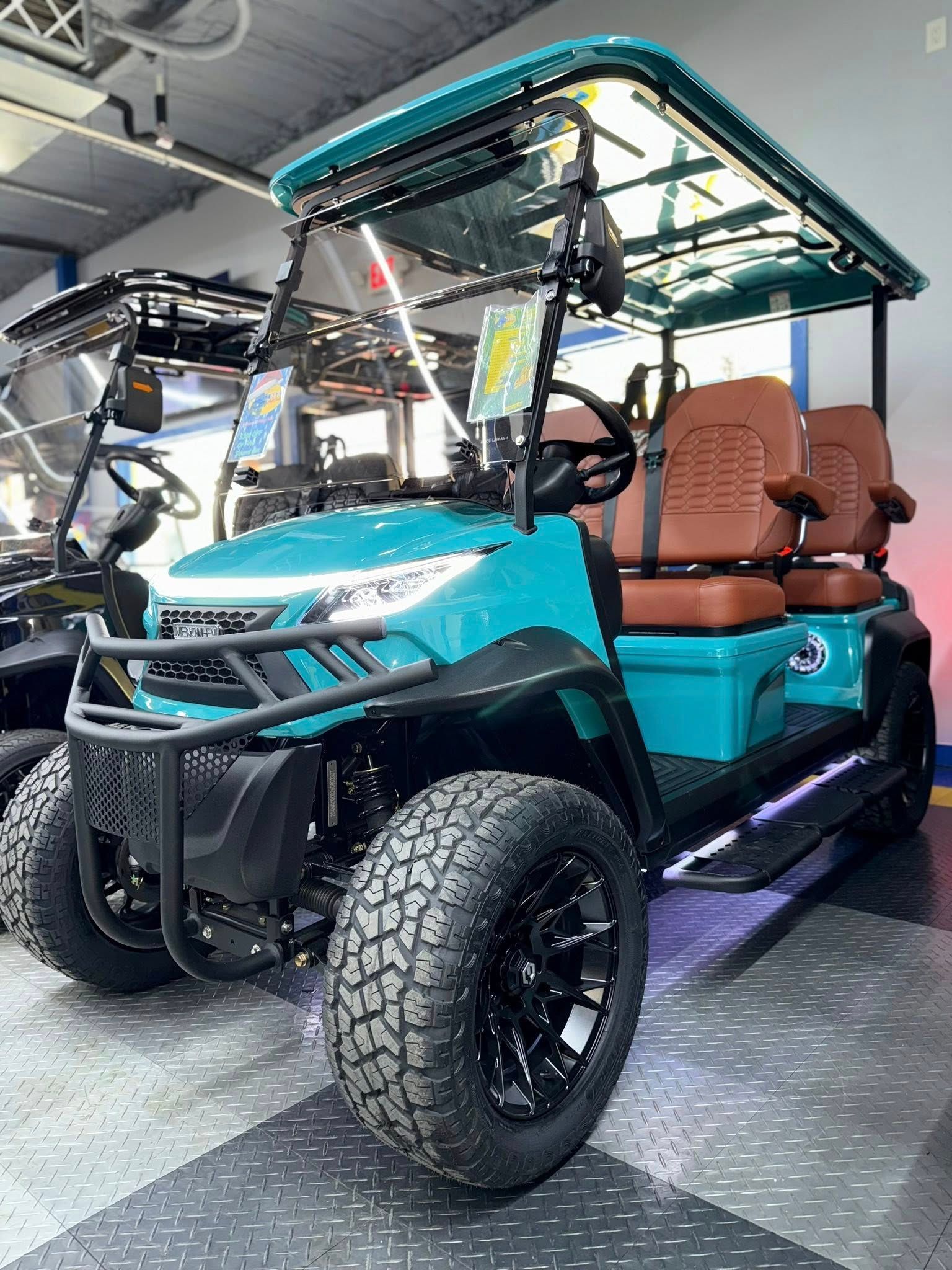 A white golf cart is parked in a showroom.