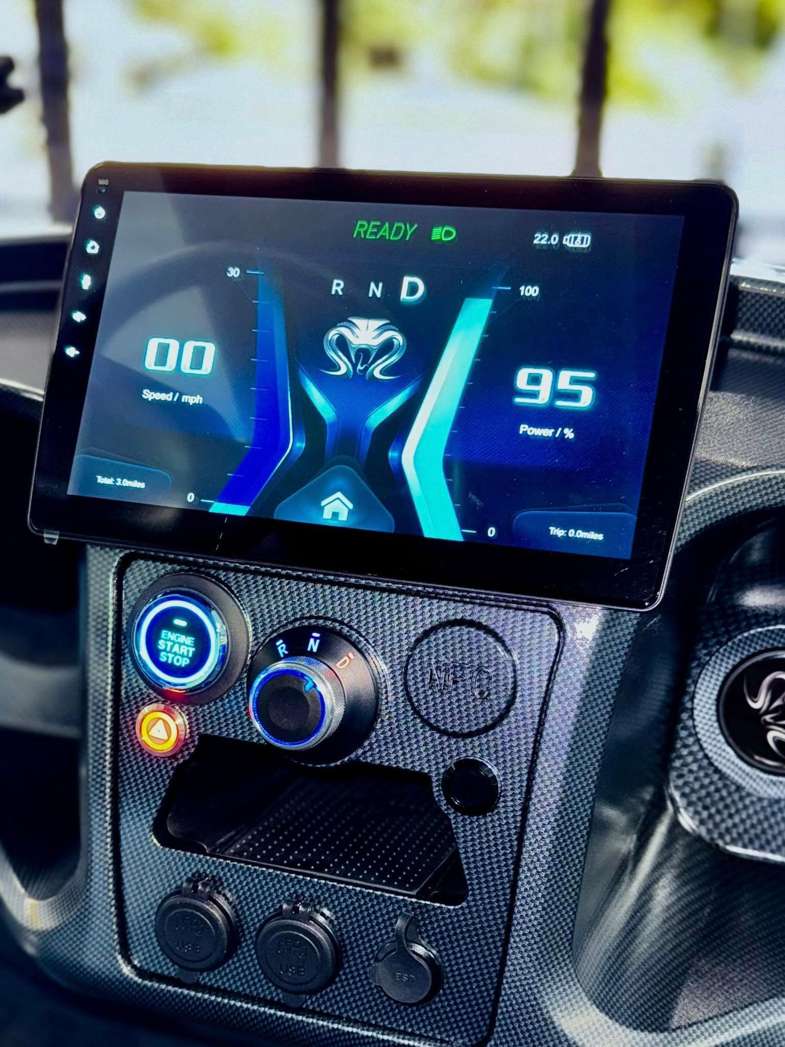 Car dashboard with a large display showing vehicle data and controls.