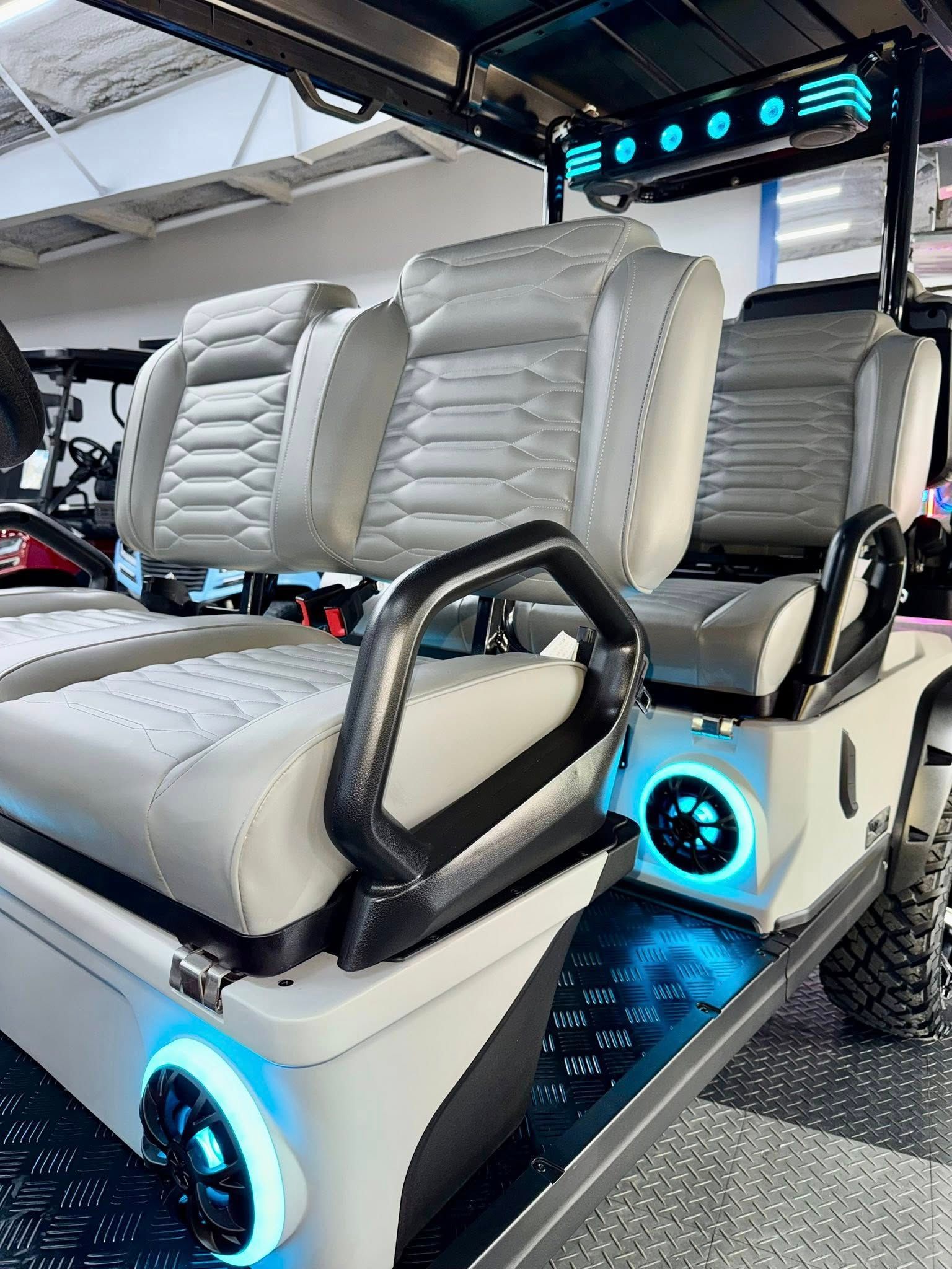 White and gray custom golf cart with LED lights.