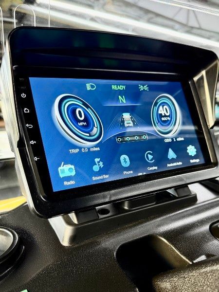 A close up of a car dashboard with a blue screen.